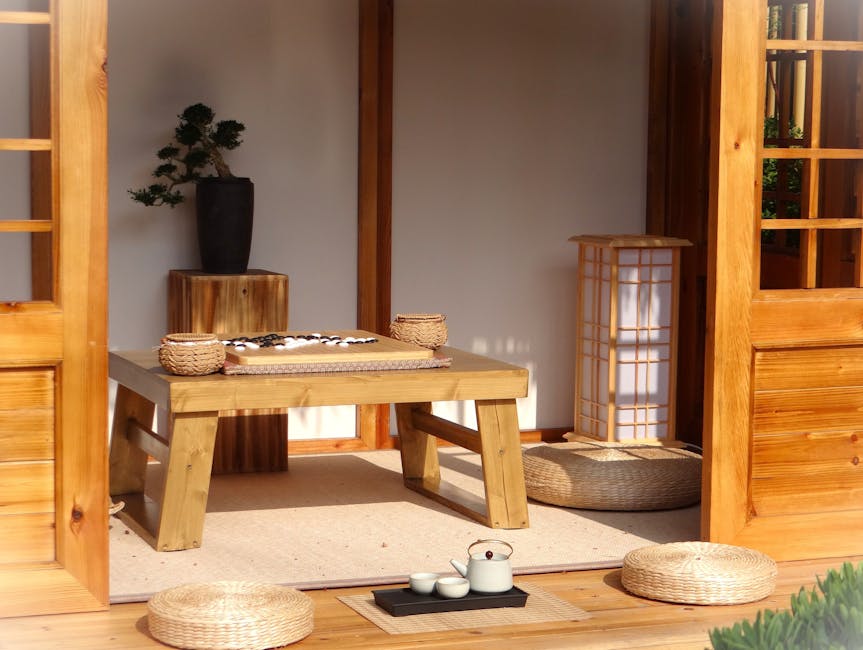 A peaceful Japanese tea room with wooden decor, tatami mat and tea set, inviting relaxation.